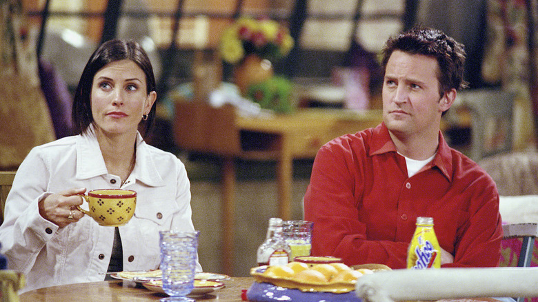 Monica and Chandler at table