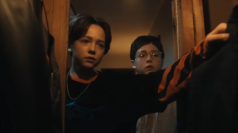 Young Hal and Bill looking in closet