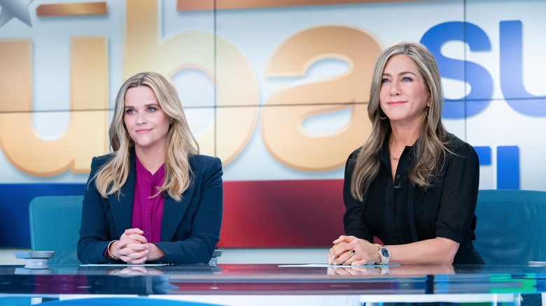 Bradley and Alex sitting at news desk