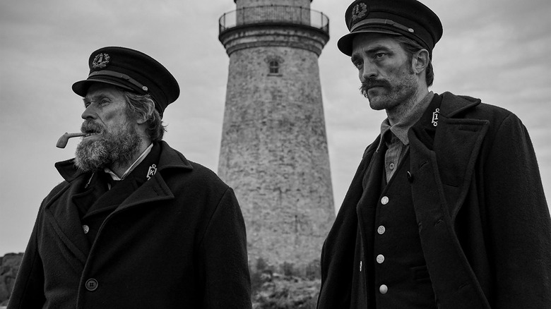 Dafoe and Pattinson at the lighthouse