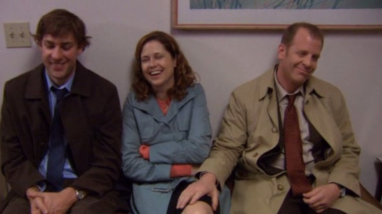 Toby feels Pam's leg