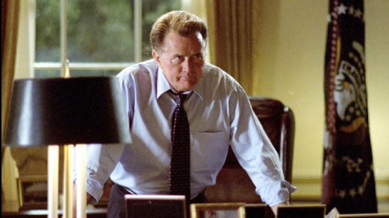 President Bartlet leans on desk