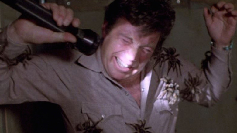 William Shatner reacts as spiders crawl on him