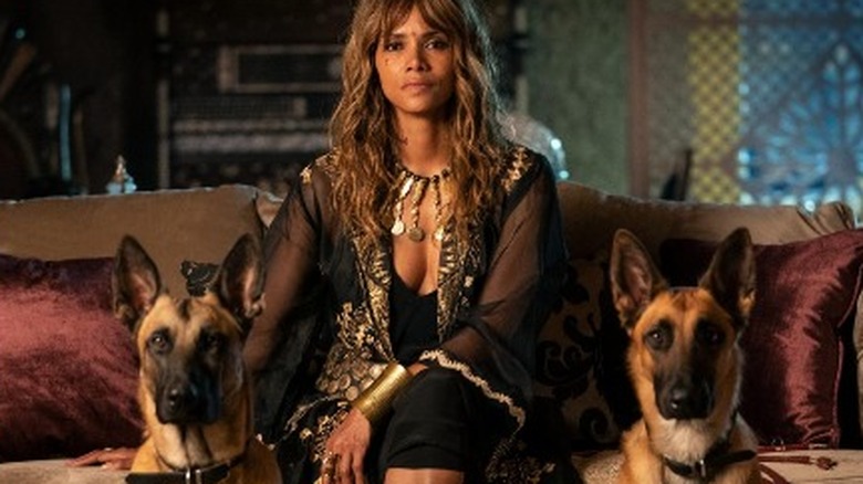 Sofia in John Wick 3 posing with her guard dogs