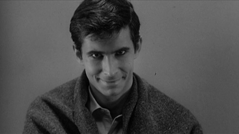 Anthony Perkins smiling as Norman Bates in Psycho