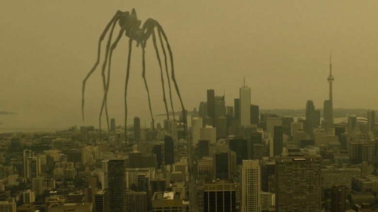 Giant spider walks through a city