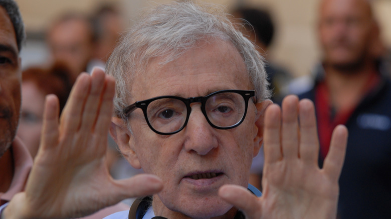 Woody Allen holding hands up