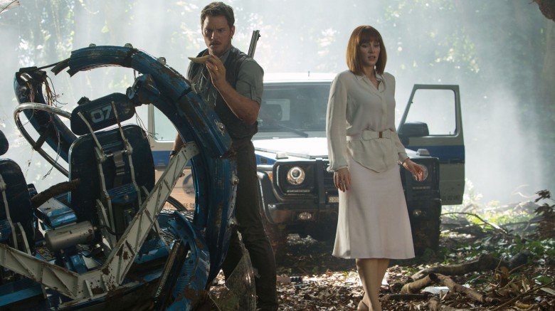 Bryce Dallas Howard and Chris Pratt survey a crash site in Jurassic World