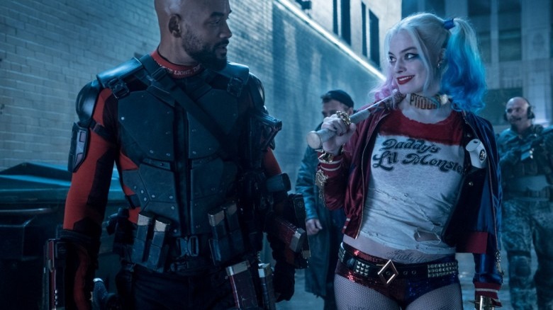 Margot Robbie and Will Smith walking and talking in Suicide Squad