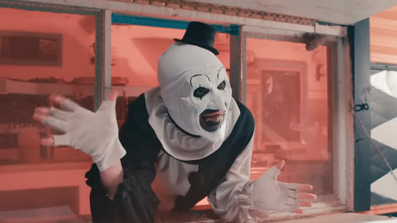 Art the Clown waving through window