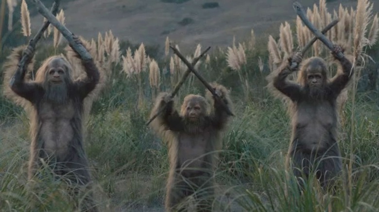 A trio of Sasquatch banging sticks