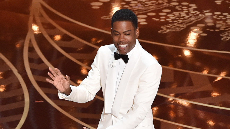 Chris Rock hands out