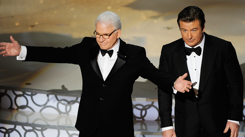 Steve Martin gestures Alec Baldwin