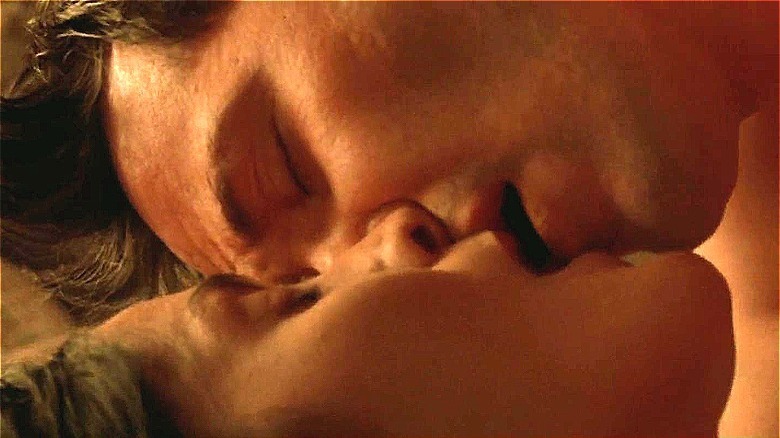 reeves and moss kissing close up