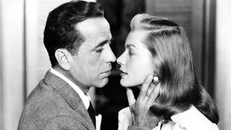 Humphrey Bogart kissing Lauren Bacall