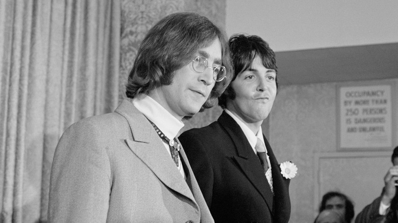 Paul McCartney and John Lennon posing