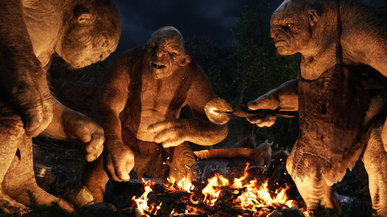 Three Stone-trolls arguing over a meal