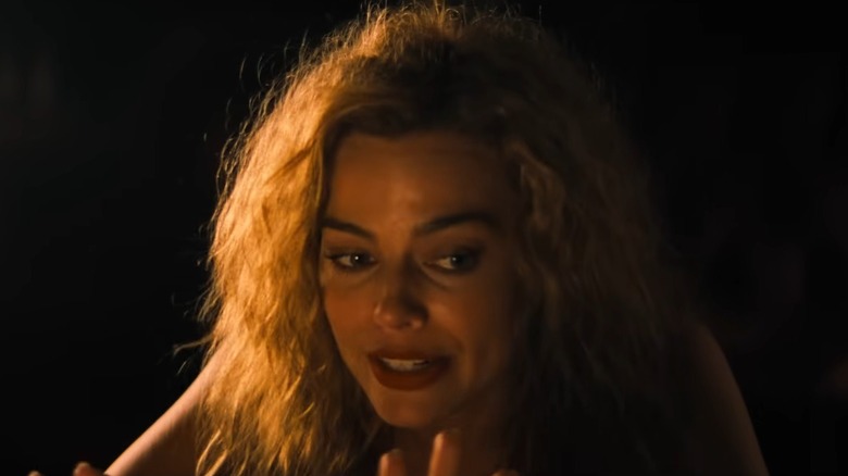 Margot Robbie gesturing and talking