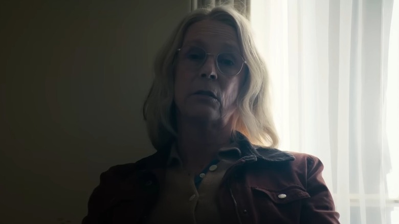 Laurie Strode sitting next to a window