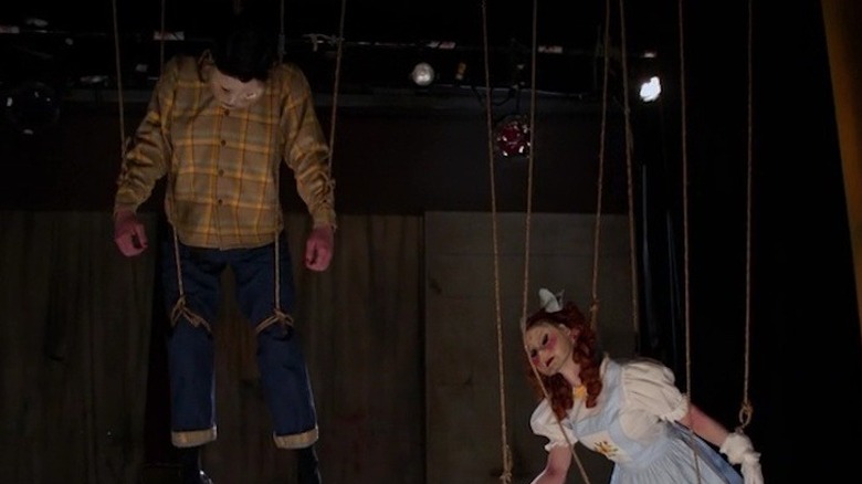 People hanged up as puppets 