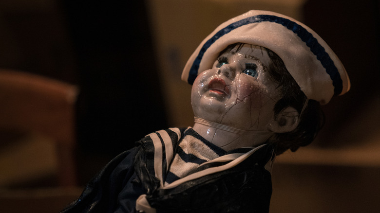 Creepy doll wearing sailor outfit 