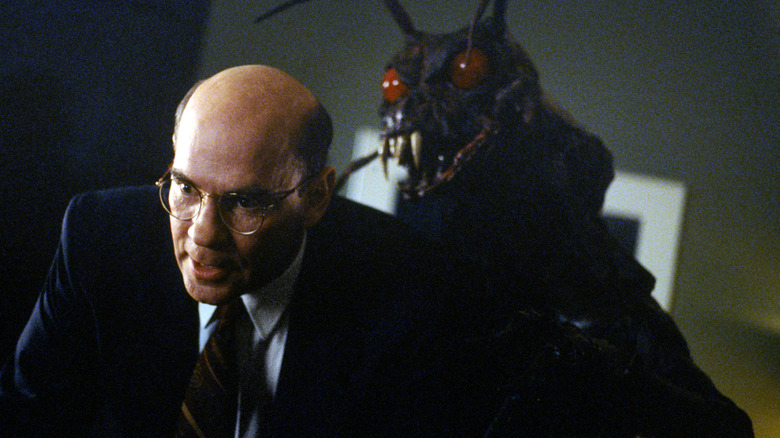 Skinner with giant bug behind him 