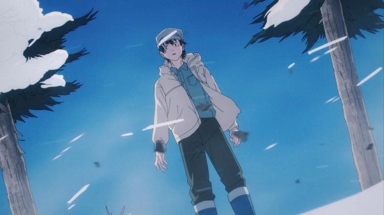 Aki stands in the snow