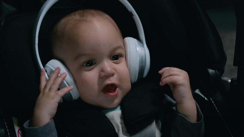 A baby with headphones on 