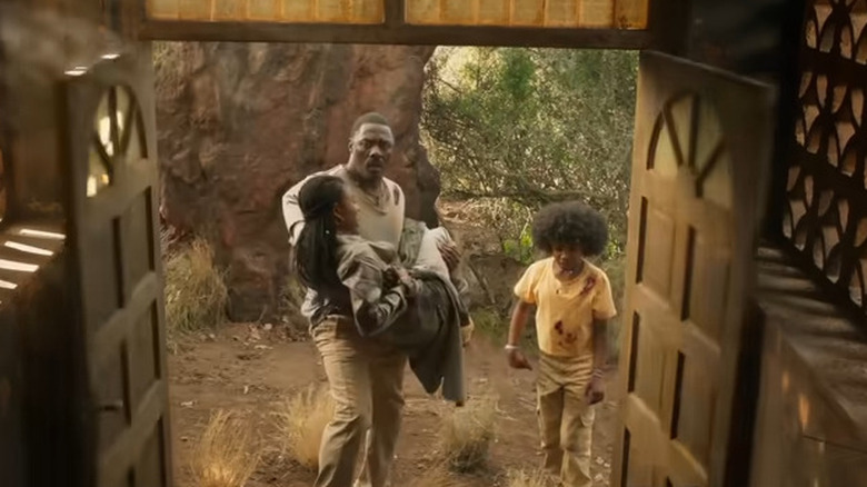 Idris Elba and the girls hide in an abandoned school