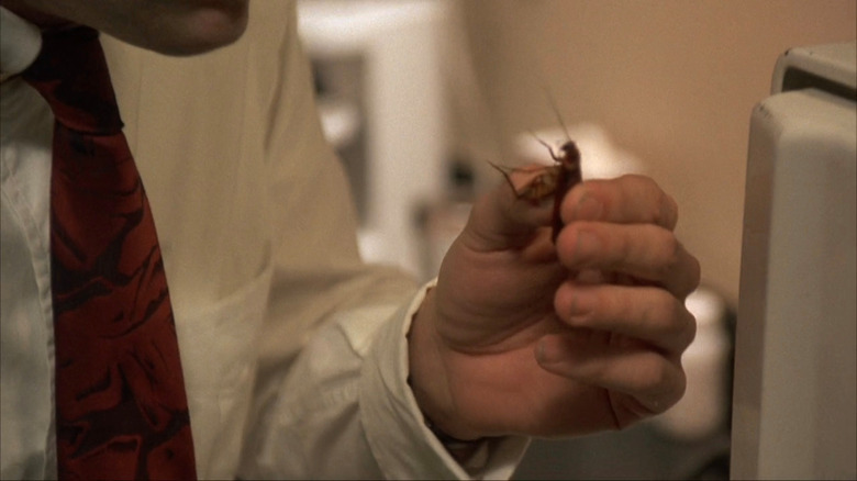 Peter holding live cockroach