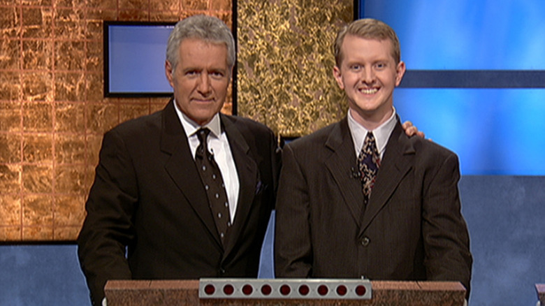 Alex Trebek and Ken Jennings pose for cameras