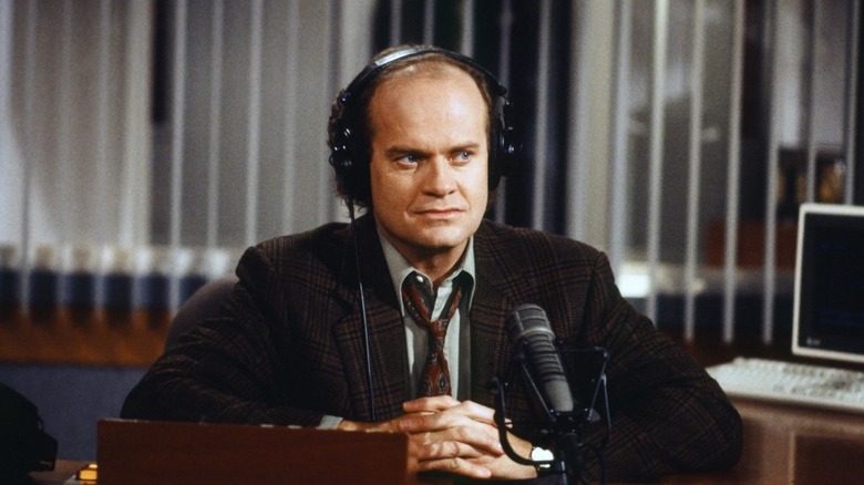 Frasier glares at Roz while on air