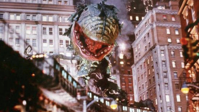 Audrey II hovers above a train