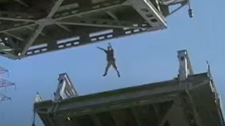 Man jumping between drawbridge