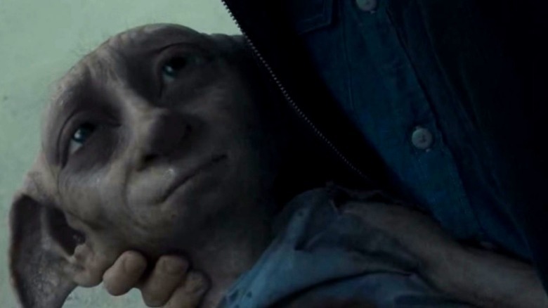 Dobby smiling in harrys arms Harry Potter