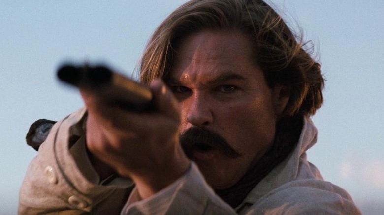 Kurt Russell with shotgun