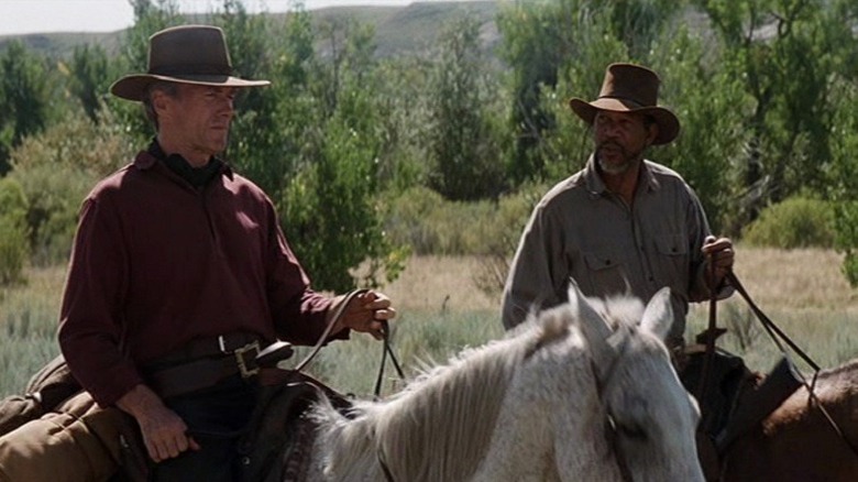 Clint Eastwood and Morgan Freeman riding horses