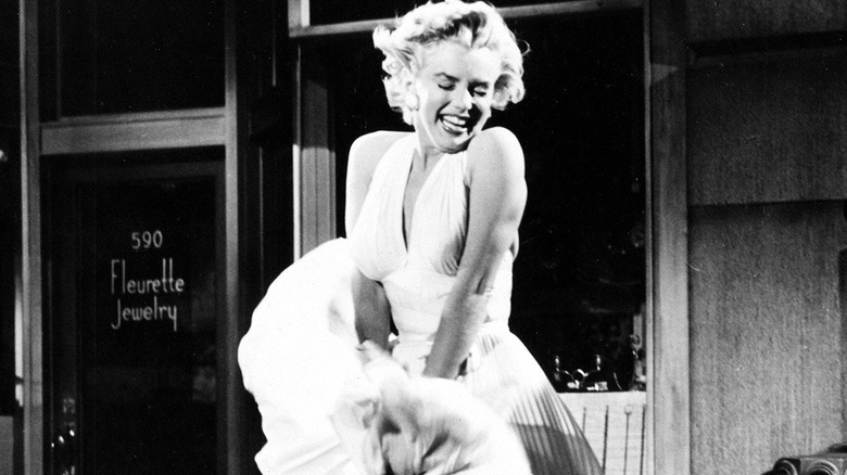 Marilyn Monroe stands over grate with blowing dress