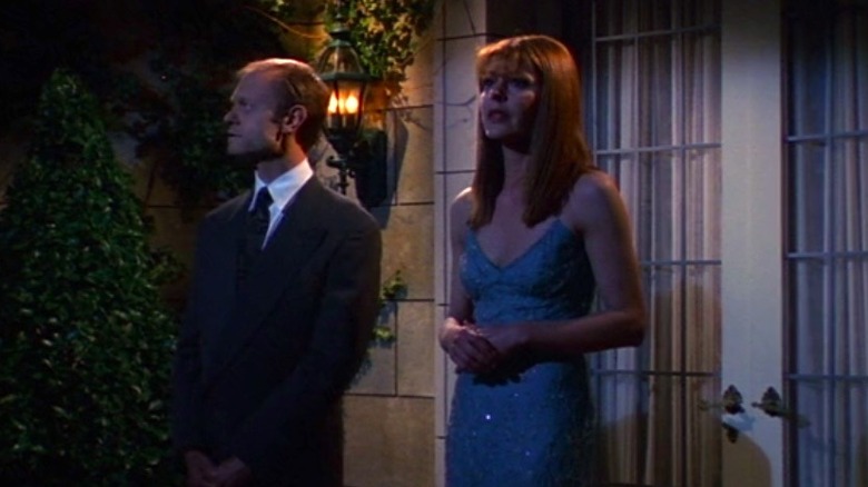 Niles and Daphne stand on balcony 