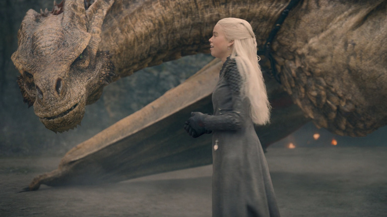 Rhaenyra Targaryen walking beside Syrax