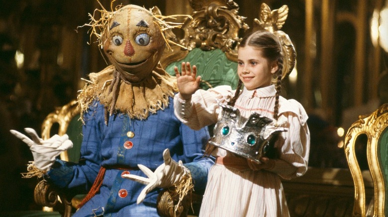 Dorothy and the scarecrow waving