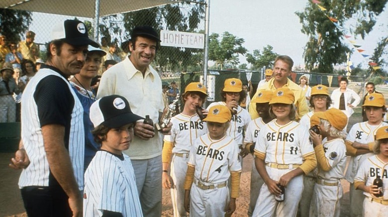 Walter Matthau drinking beer near little league team