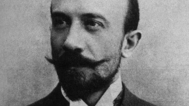 George Méliès sits in black and white portrait in 1890