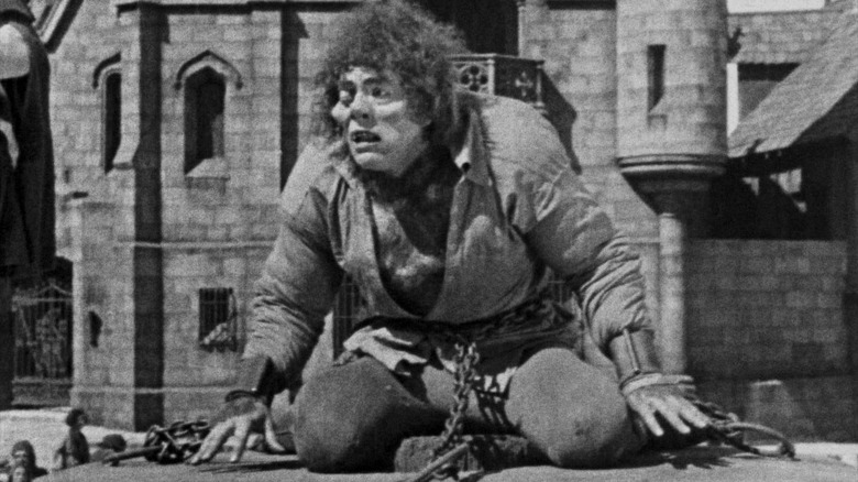 Quasimodo sits in chains