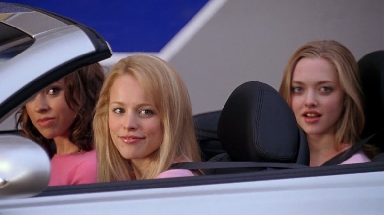 The Plastics smile from convertible