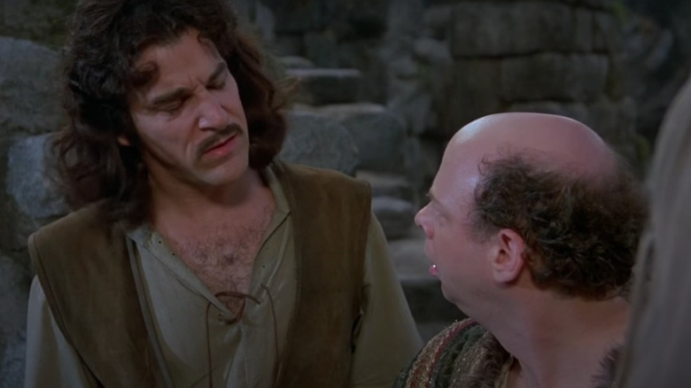 Mandy Patinkin looks concerned at Wallace Shawn