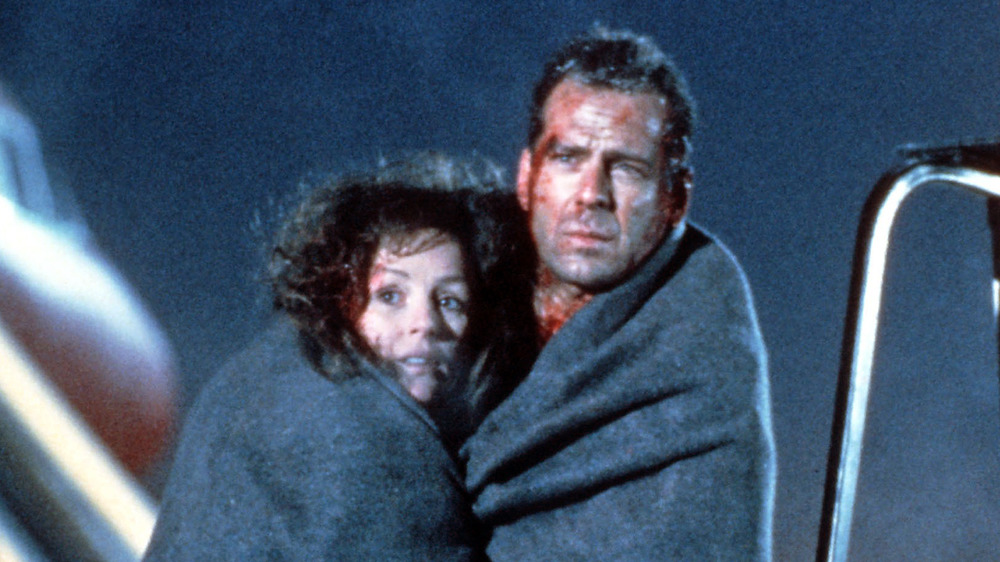 Bruce Willis as John McClane and Bonnie Bedelia as Holly Gennero-McClane in Die Hard