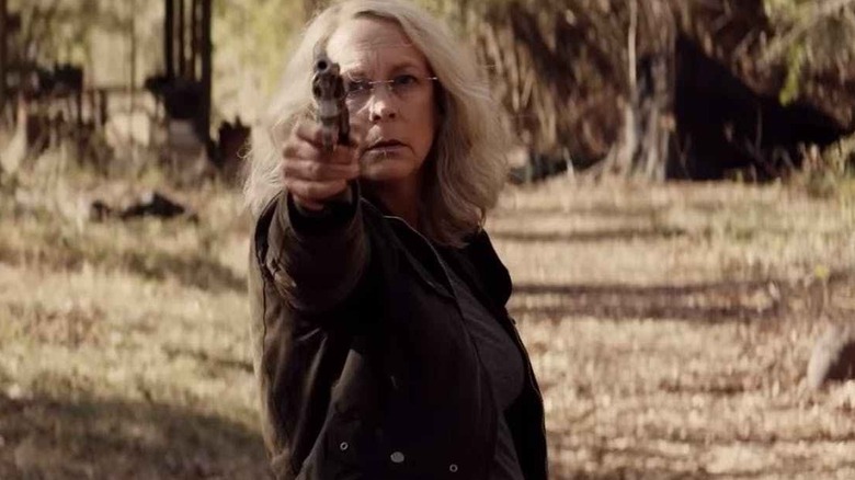 Jamie Lee Curtis pointing pistol