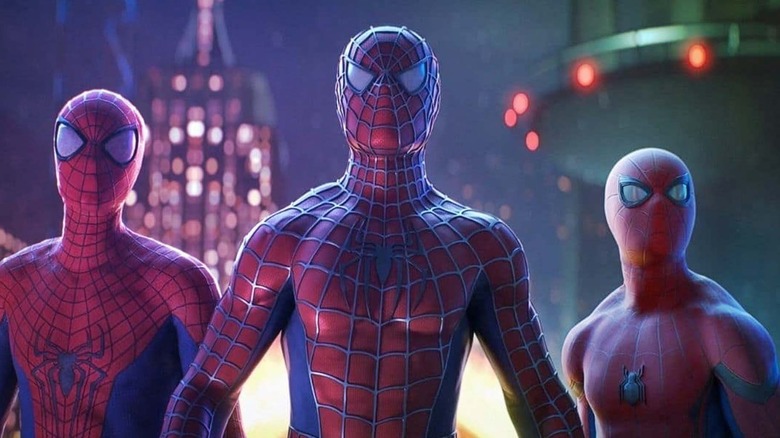 Three Spider-Men staring intently