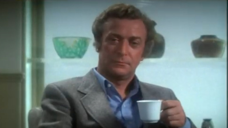 Michael Caine holding teacup